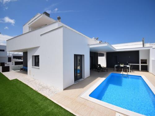 a swimming pool in the backyard of a house at Sunny Villa Near Óbidos w Beaches in Nadadouro