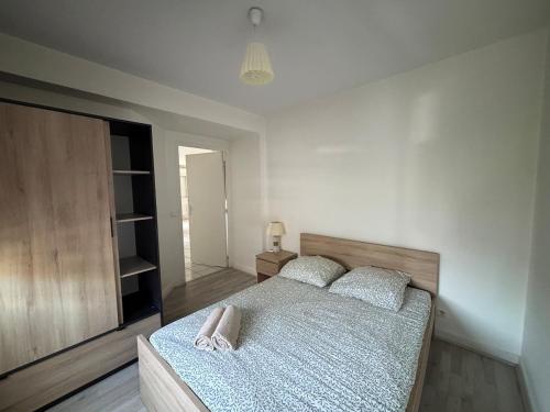 Katil atau katil-katil dalam bilik di Logement cosy avec ascenseur