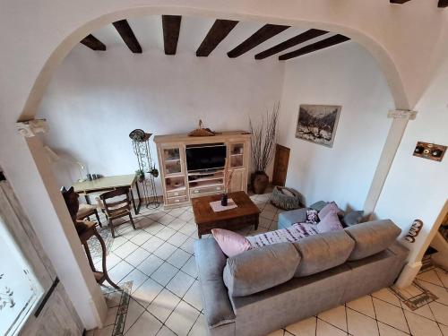 a living room with a couch and a table at Marina Vila House, Masnou in Masnou