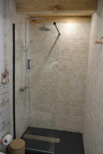 a shower with a glass door in a bathroom at Marina Vila House, Masnou in Masnou