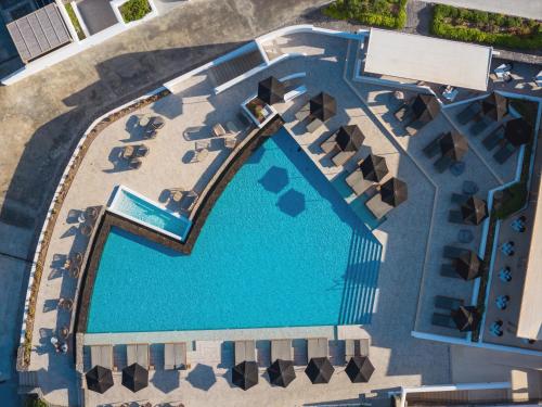 an overhead view of a pool at a resort at Santo Pure Oia Suites & Villas in Oia
