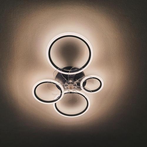 a chandelier is hanging from a ceiling at Mythos Home in Mirina
