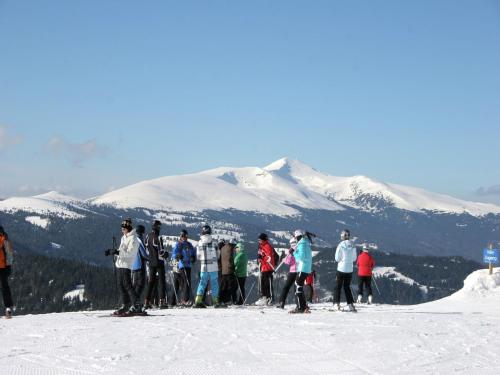 a group of people standing on top of a ski slope at Chalet in Prebl near Klippitztörl Ski Area in Prebl