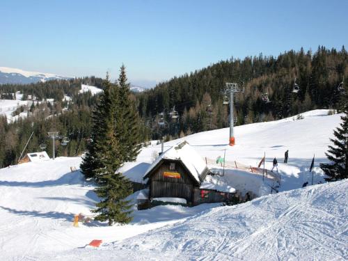 a small cabin in the snow on a ski slope at Chalet in Prebl near Klippitztörl Ski Area in Prebl
