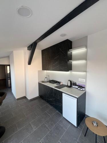 a kitchen with a sink and a counter at LiboroApartments in Niš
