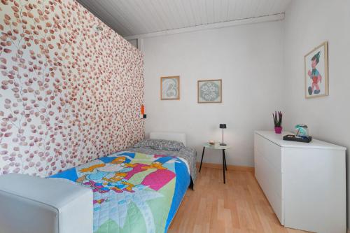Katil atau katil-katil dalam bilik di Isola Bella Apartment