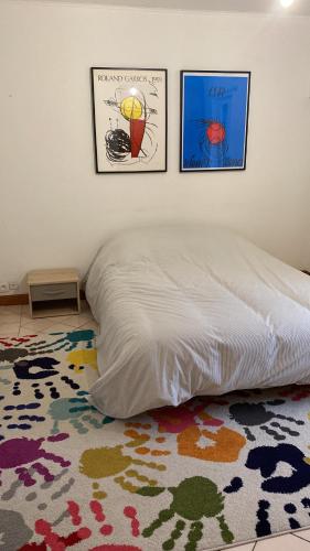 En eller flere senge i et værelse på Maison AMIE