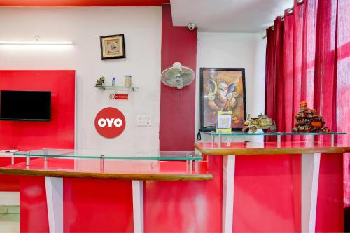 Una televisión o centro de entretenimiento en Hotel O Elibrista