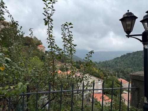 a street light and a view of a mountain at Villa Marcelle in Evisa