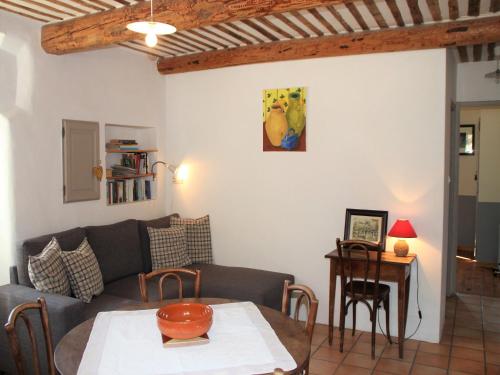 a living room with a couch and a table at Holiday Home in Lacoste with Pool in Lacoste