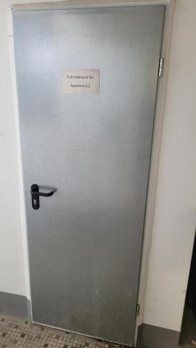 a metal door with a sign on it at Vlotho Apartment 2 in Vlotho