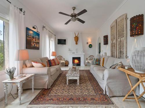 a living room with a couch and a fireplace at Elegant Villa with Pool in Benissa