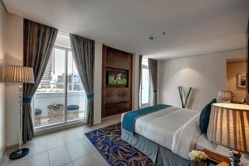 Postel nebo postele na pokoji v ubytování Omega Hotel Dubai