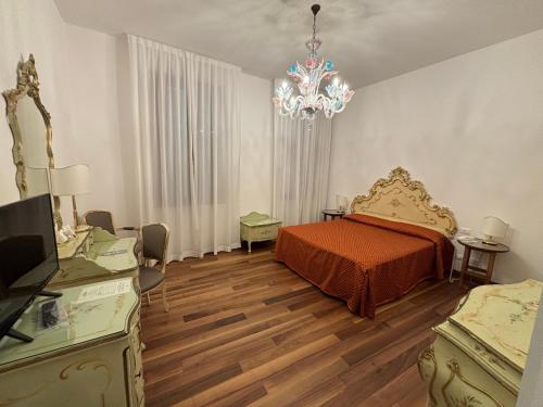Un ou plusieurs lits dans un hébergement de l'établissement Hotel Rialto