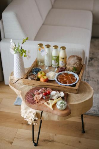 a table with two trays of food on it at Menart Estate in Cerklje na Gorenjskem