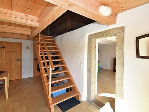 a wooden staircase in a room with a ceiling at Ferienhaus in Konzell mit Terrasse in Konzell