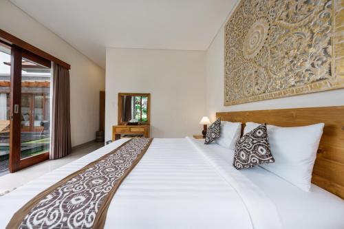 Ένα ή περισσότερα κρεβάτια σε δωμάτιο στο Villa Guru Peaceful 2BR Pool Retreat