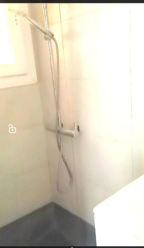 a shower in a bathroom with a shower head at Thalassa View c2 in Khalkoútsion