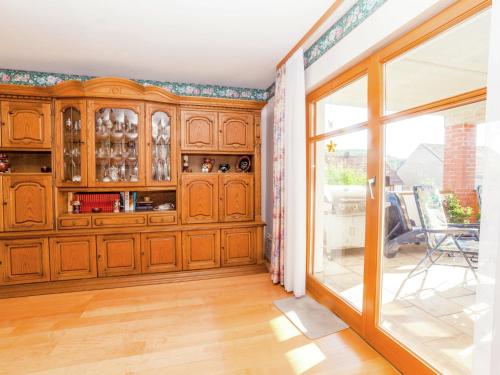 a large wooden cabinet in a room with a window at Wohnung in Densberg nahe Kellerwald in Densberg