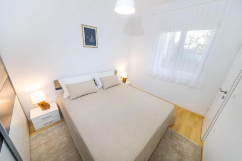 Posteľ alebo postele v izbe v ubytovaní Apartment Lavander