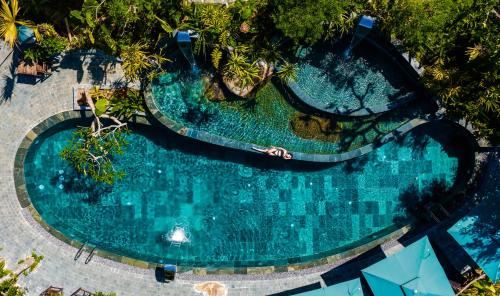 an overhead view of a swimming pool with trees at Asia Tropical Resort and Spa in Làng Coc
