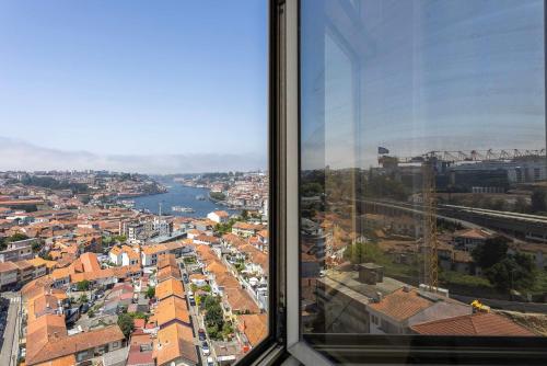 a view of a city from a window at Liiiving in Gaia - Douro Balcony View in Vila Nova de Gaia