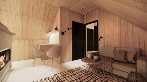 a living room with a couch and a fireplace at Vaattunki Wilderness Resort in Rovaniemi