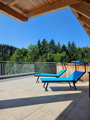 two ping pong tables sitting on a patio at OpenSky Wörthersee Lodge in Pörtschach am Wörthersee