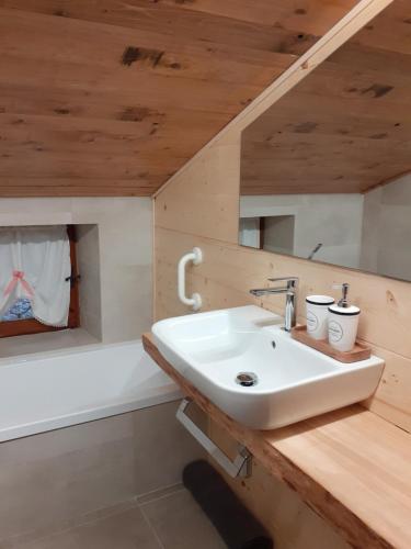 a bathroom with a sink and a bath tub at Baita Amiata in Monte Amiata