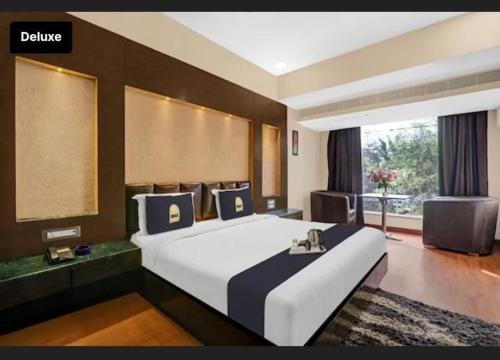 En eller flere senge i et værelse på Hotel Tourist