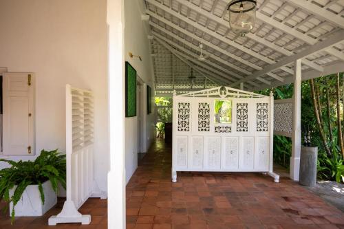 a hallway of a house with a white door at Nyne Hotels Rock Villa - Bentota in Bentota