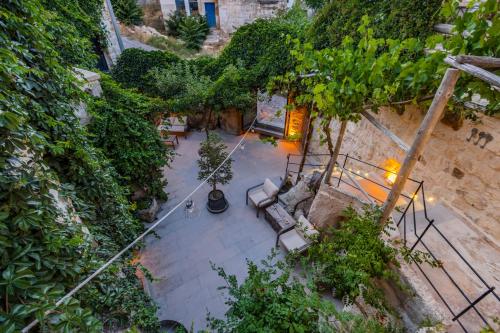 an overhead view of a patio with chairs and trees at Kayata Cave Suites Special Class in Urgup
