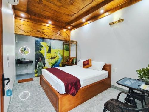 a bedroom with a bed and a tv in a room at Trang An Natural Mountainside Homestay in Ninh Binh
