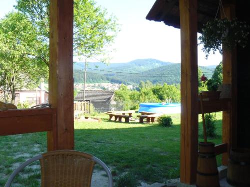 a view of a backyard with a picnic table and a pool at Chalupa na Valašsku in Halenkov