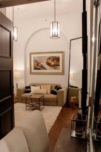a living room with a couch and a table at Sydney Harbourside Escape in Sydney