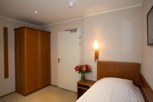 Postel nebo postele na pokoji v ubytování Landhotel De Hoofdige Boer