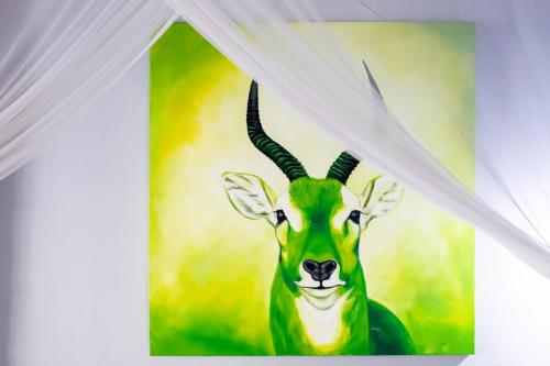 a painting of a gazelle at Chameleon Hill Forest Lodge in Bwindi