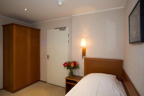 Postel nebo postele na pokoji v ubytování Landhotel De Hoofdige Boer
