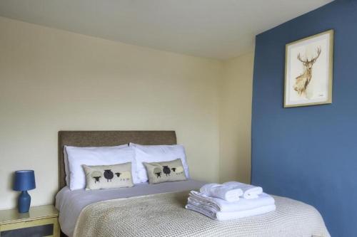 a bedroom with a bed with towels on it at The New Rushcart Inn & Country Dining in Sowerby Bridge
