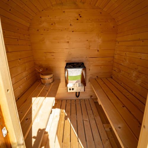 an inside view of a wooden sauna at Pensiunea Plaiul Domnesc Runcu in Runcu
