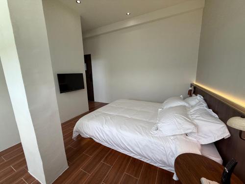 Ein Bett oder Betten in einem Zimmer der Unterkunft Nancheng Renlan