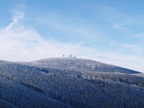 a hill with a cross on top of it at Retreat with Private Garden in Güntersberge