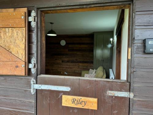 a wooden door with a sign that says ruby at The Riley Stable in Waterlooville