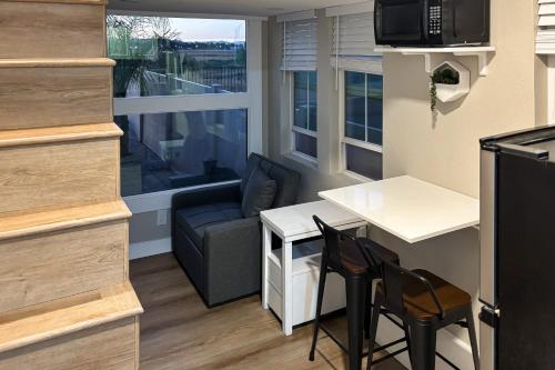 a small living room with a couch and a table at Perris Paradise in Perris