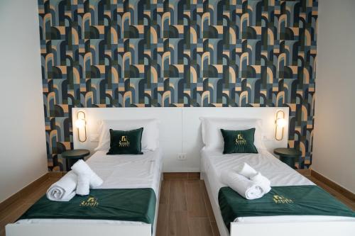 Postel nebo postele na pokoji v ubytování Ruah Pompei