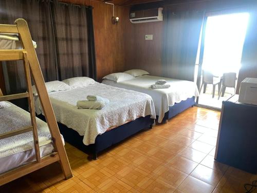 Ένα ή περισσότερα κρεβάτια σε δωμάτιο στο Hotel Mejor Ubicacion en Sarie Bay San Andrés