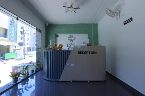 a lobby with a reception desk in a building at The Lotus Park in Srikalahasti