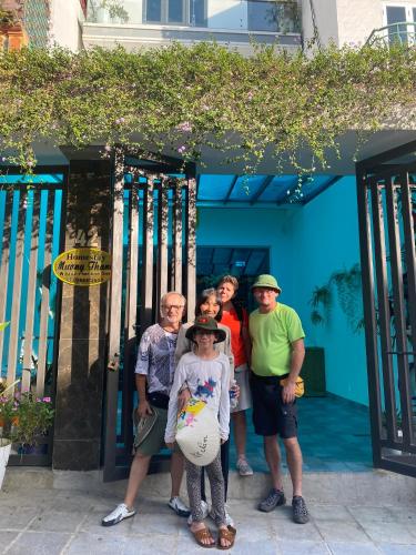 a group of people standing in front of a building at Muong Thanh Homestay in Diện Biên Phủ
