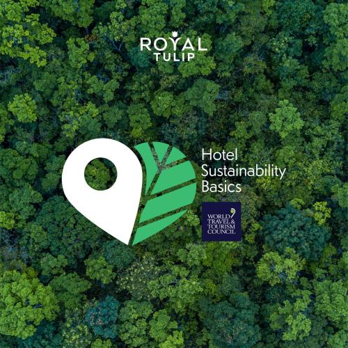 a heart with a leaf in the middle of a forest at Royal Tulip Muscat in Muscat