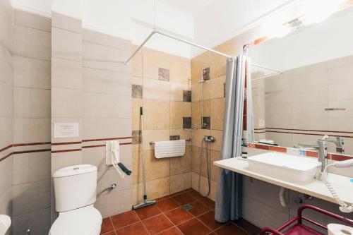 a bathroom with a toilet and a sink at Hotel Villa Sevasti in Katerini